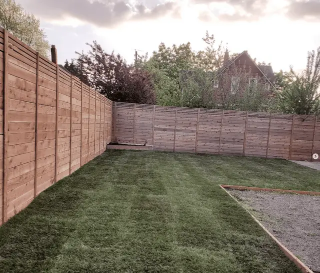 Backyard cedar privacy fence with fresh lawn installation in Happy Valley OR – Oregon Quality Cuts