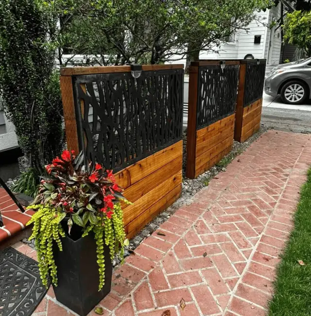 Decorative cedar privacy fence with black metal screen panels in Portland OR – Oregon Quality Cuts