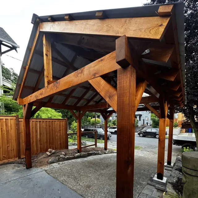 Timber frame patio cover with metal roof in Beaverton OR – Oregon Quality Cuts outdoor structure
